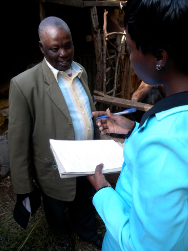 A Juhudi loan officer interviews Kiva entrepreneur Stephen Musa