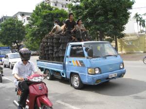 Driving down Phnom Penh I saw this truck loaded to the max with metal brackets AND people