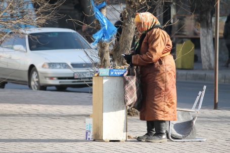 an elderly lady I often see selling gum and candy on the street, even on the coldest winter days
